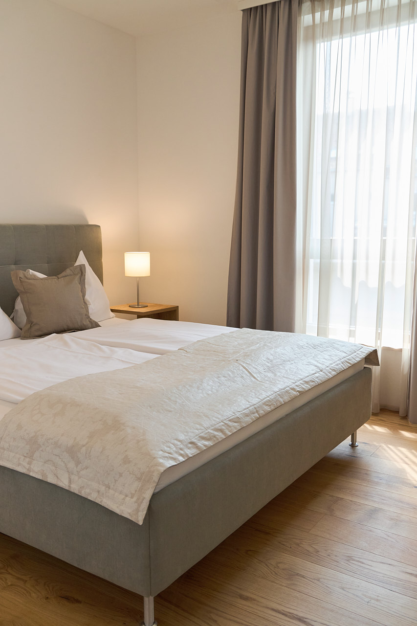 Bett im Schlafzimmer eines Apartments von zuHaus Gamlitz.